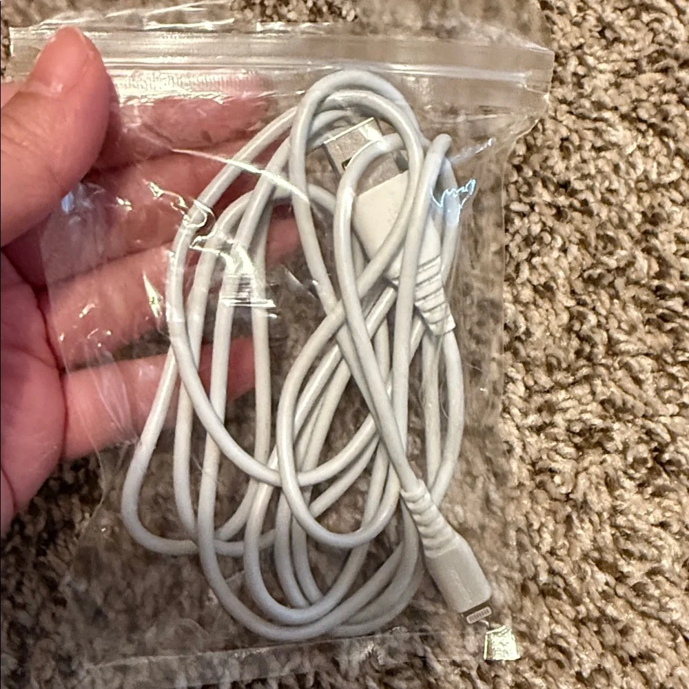3 USB-A to Lightening Charging cables and one Apple charger block